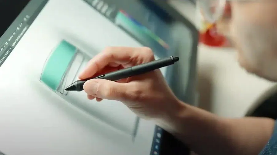 An industrial designer sketches a container concept with a stylus on a pen display, the product sketch visible on screen.