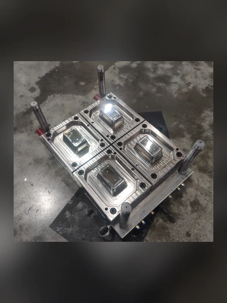 A four-cavity injection mould on the shop floor