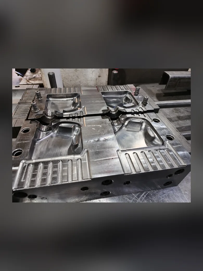 A machined twin-cavity jerrycan blow mold on the bench