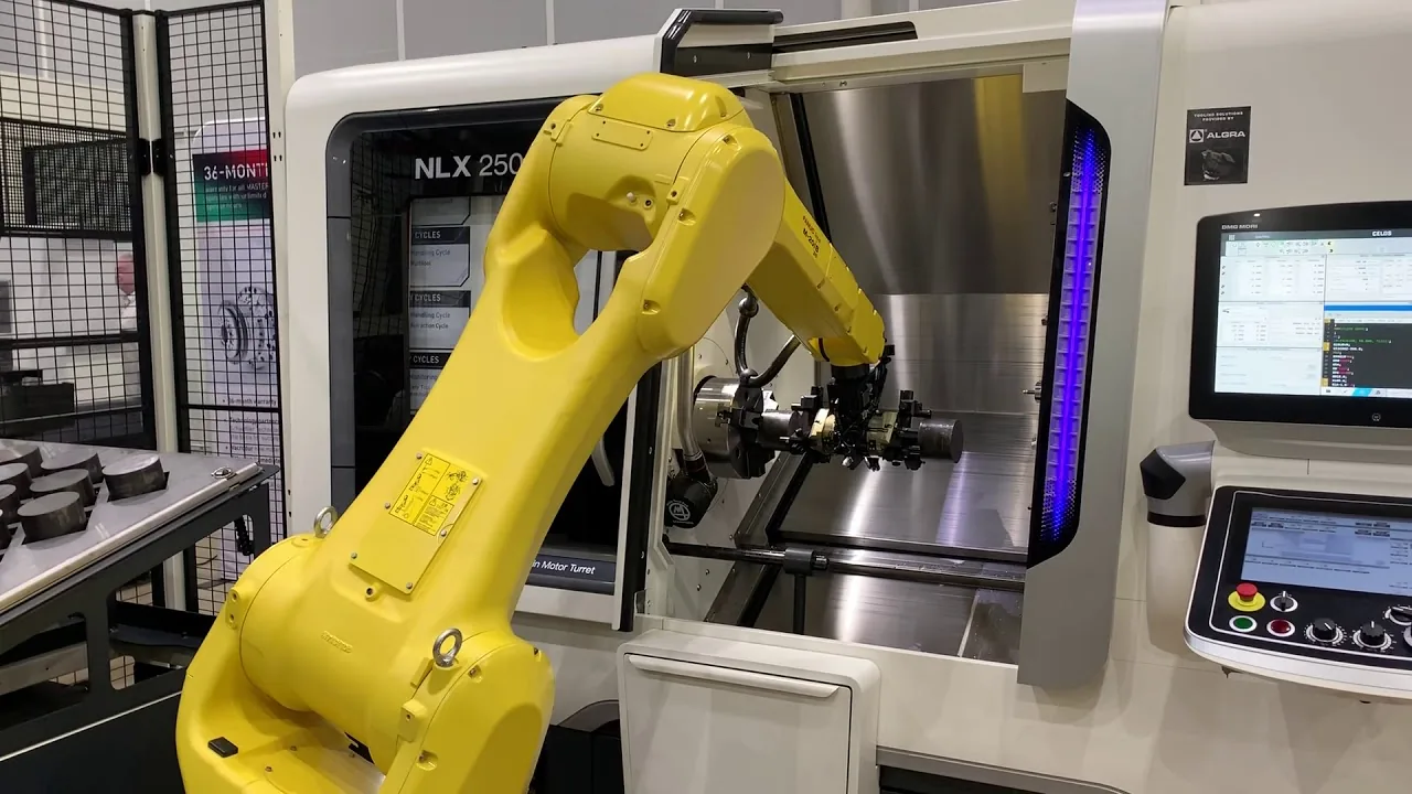 A robot arm loading a CNC turning centre in the Advanced Molds toolroom
